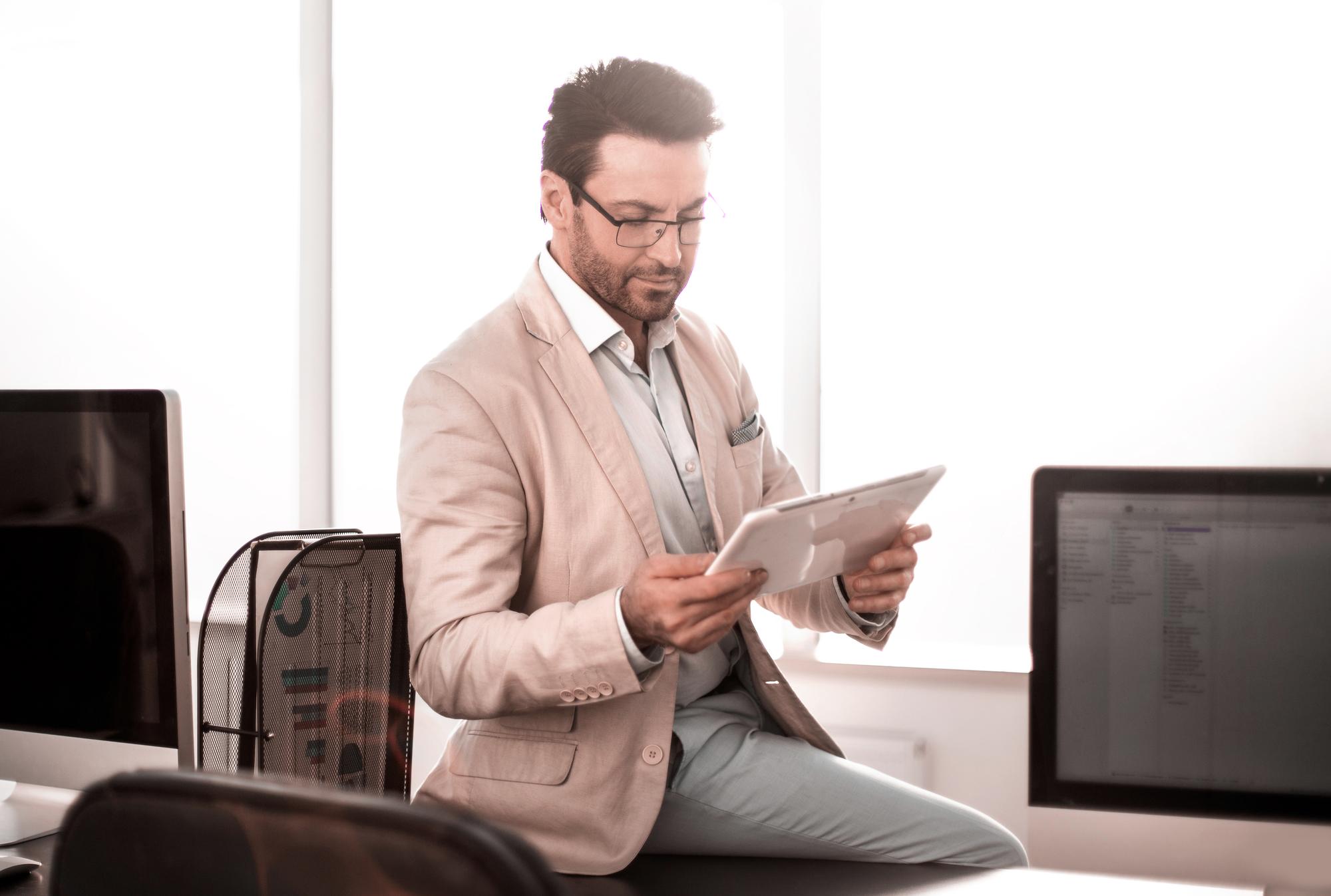 young investor reviewing stocks on tablet